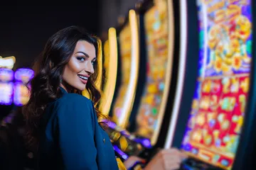 A close-up shot of golden coins falling around a spinning roulette wheel, representing immersive casino action at BETPH7.