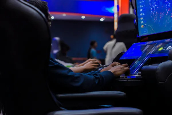 A dramatic shot of winning sevens landing on a slot reel surrounded by shining gold coins, symbolizing big wins.
