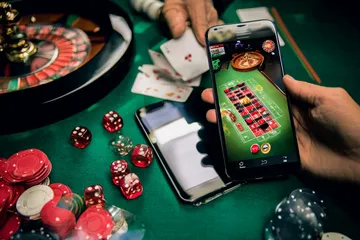 A person using their device against a moody casino-themed background, illustrating the smooth re-entry process at BETPH7.